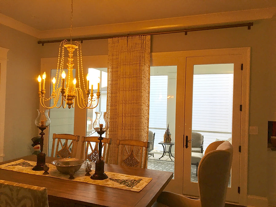 The same sheer draperies drawn open, stacked at the sides of the window